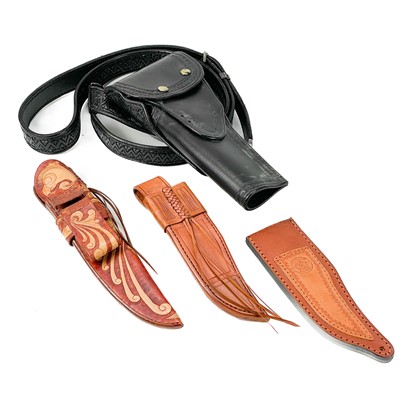 Lot 221 - A handmade leather cartridge belt with attached gun holster.