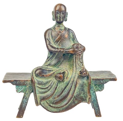 Lot 1323 - A Chinese miniature bronze figure of a seated Buddha, 19th century.