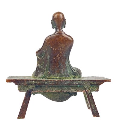 Lot 1323 - A Chinese miniature bronze figure of a seated Buddha, 19th century.