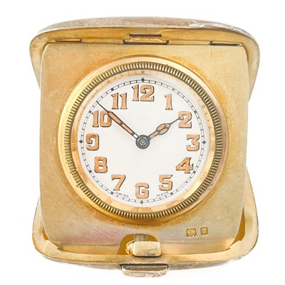 Lot 89 - A silver engine turned manual wind travel watch.