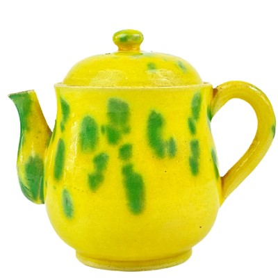 Lot 1428 - A Japanese yellow glazed teapot, circa 1900.