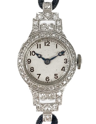 Lot 180 - An Art Deco platinum and diamond cased lady's manual wind wristwatch.