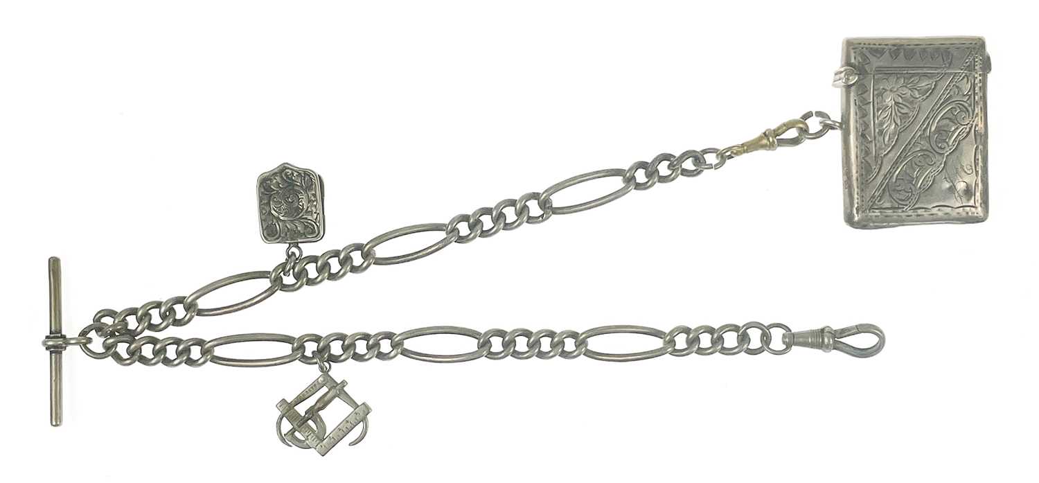 Lot 99 - A silver Albert watch chain applied with two charms and a fob vesta.