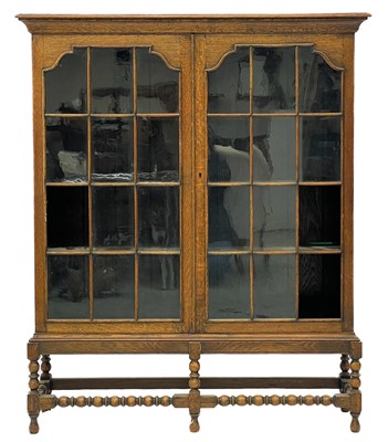 Lot 376 - An oak display cabinet or bookcase.