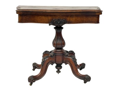 Lot 408 - A Victorian burr walnut serpentine shape fold top card table.