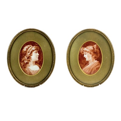 Lot 568 - A pair of late Victorian oval painted porcelain portrait plaques.