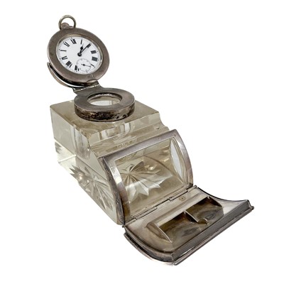 Lot 335 - An Edwardian combined silver mounted glass watch holder, stamp box and inkwell.