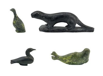 Lot 134 - An Inuit soapstone carved figure of an otter.