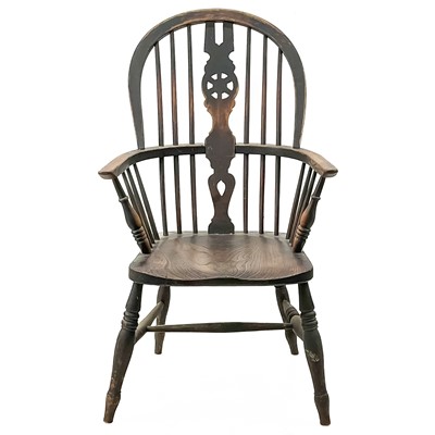 Lot 45 - A Victorian ash and elm wheelback Windsor armchair.
