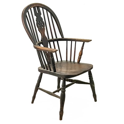 Lot 45 - A Victorian ash and elm wheelback Windsor armchair.