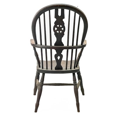 Lot 45 - A Victorian ash and elm wheelback Windsor armchair.