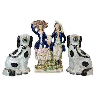 Lot 284 - A pair of late Victorian Staffordshire spaniels.