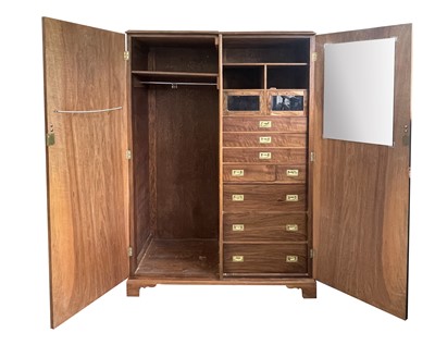 Lot 389 - A first quarter of the 20th century walnut bachelor's wardrobe.