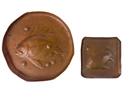 Lot 161 - A Newlyn copper circular pin tray repousse decorated with a fish.