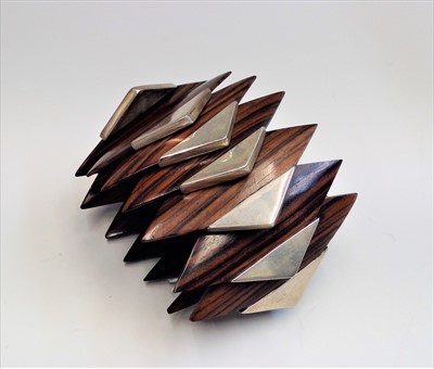 Lot 2538 - A Modernist rosewood bracelet.