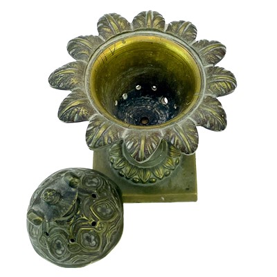 Lot 11 - A Regency bronze pastille burner and cover.