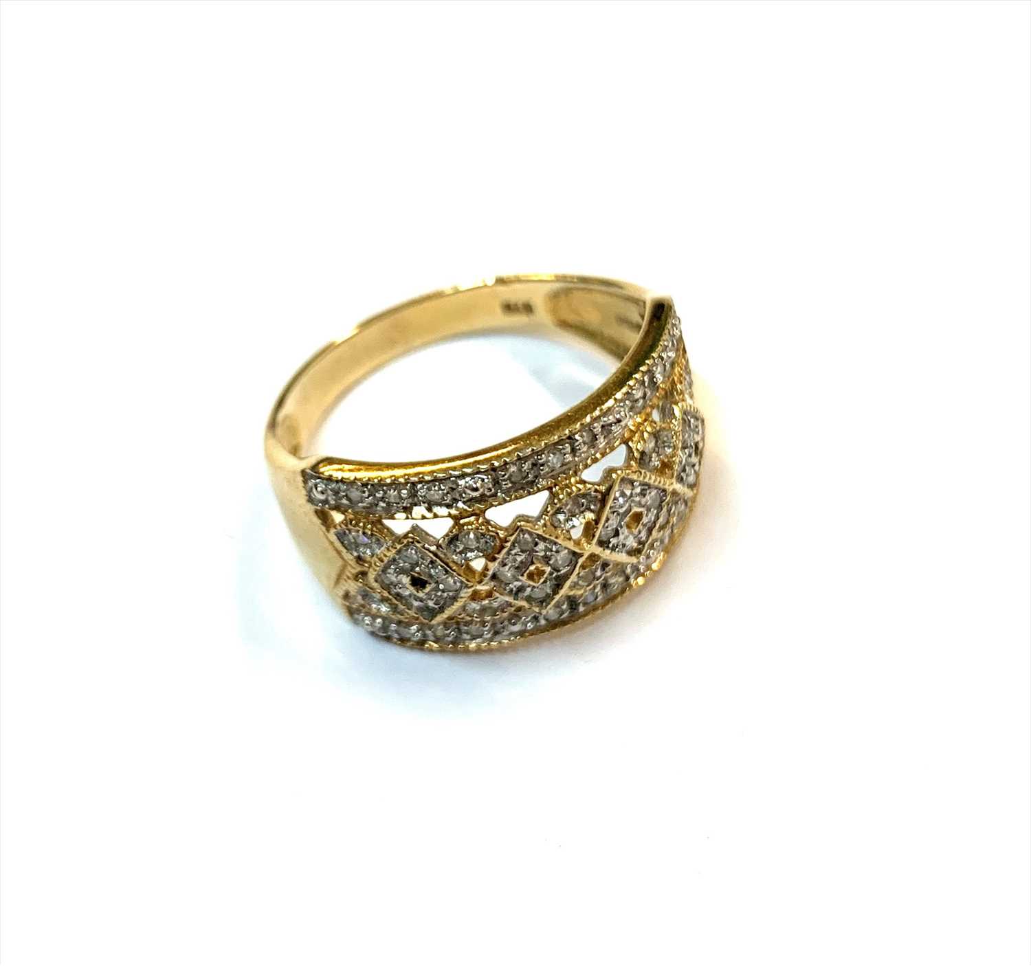 Lot 2462 - A 9ct gold ring set with a fancy trellis work...