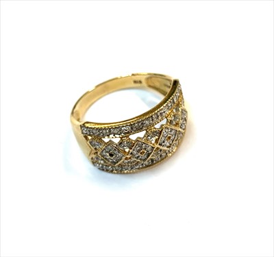 Lot 2462 - A 9ct gold ring set with a fancy trellis work...