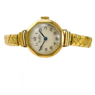 Lot 115 - Three 9ct gold-cased lady's manual wind wristwatches and a 9ct expanding bracelet.