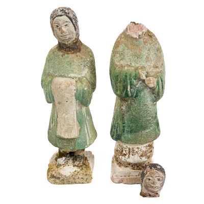 Lot 1063 - A pair of Chinese Han type pottery figures.