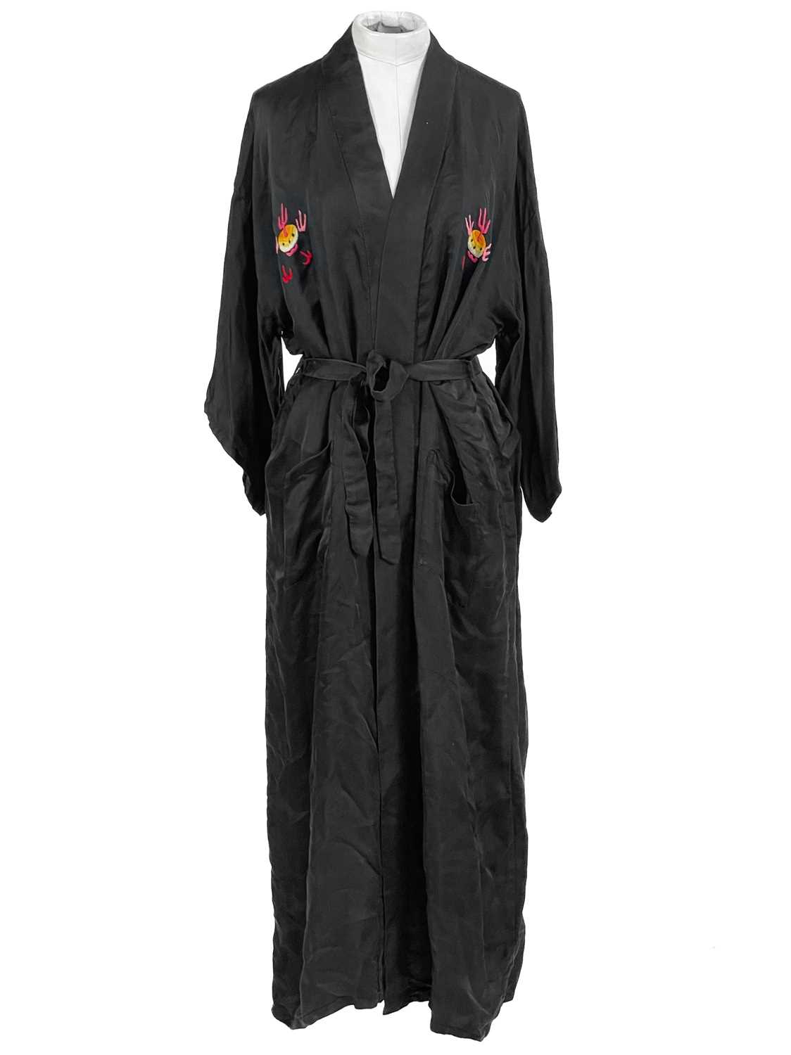 Lot 1423 - A Chinese black silk dressing gown, 20th century.