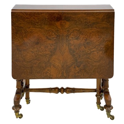 Lot 672 - A Victorian figured walnut Sutherland table.