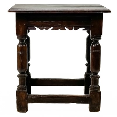 Lot 1257 - An oak joined stool.