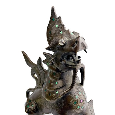 Lot 1291 - A Burmese bronze lion dog, late 19th century.