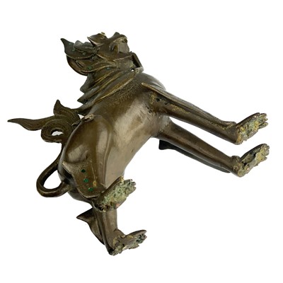 Lot 1291 - A Burmese bronze lion dog, late 19th century.