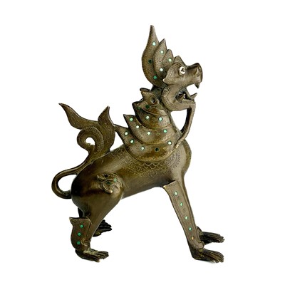 Lot 1291 - A Burmese bronze lion dog, late 19th century.
