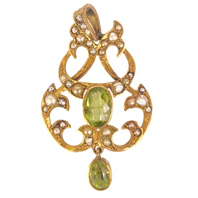 Lot 370 - An Edwardian Art Nouveau, peridot and split seed pearl pendant.