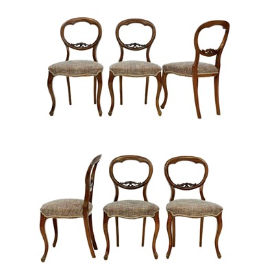 Lot 671 - A set of six Victorian rosewood balloon back dining chairs.