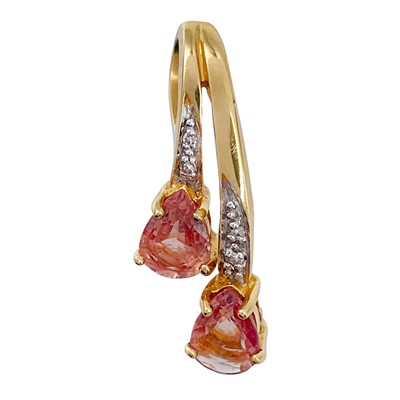 Lot 137 - An 18ct diamond and Padparadscha sapphire pendant.