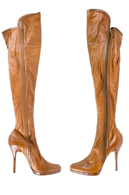 Lot 552 - A pair of Gucci tan leather knee high stiletto heel boots.