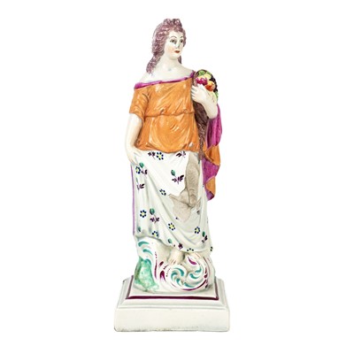 Lot 323 - An early 19th century Staffordshire pearlware figure of Ceres.