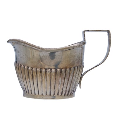Lot 10 - A George III silver milk jug, and two other silver milk jugs.