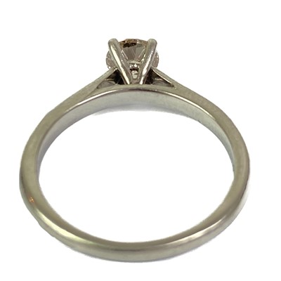 Lot 16 - A platinum 0.75ct (estimated) champagne diamond solitaire ring.