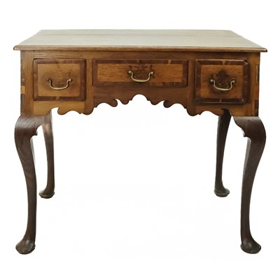 Lot 358 - A George III oak and fruitwood banded lowboy.