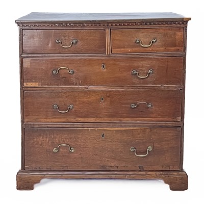 Lot 205 - A late George III oak chest.