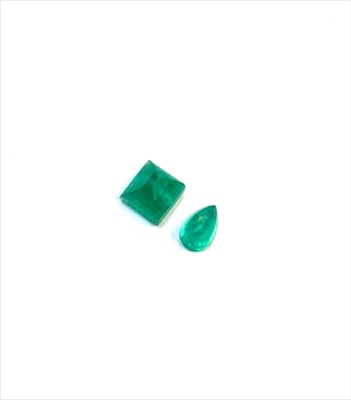 Lot 2455 - Two cut unmounted emeralds
