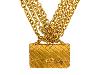 Lot 472 - A Chanel 24ct gold-plated large double flap bag pendant choker necklace, circa 1990/91.