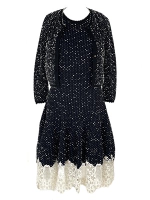 Lot 493 - An Oscar De La Renta navy blue and white wool knitted dress and matching cardigan.