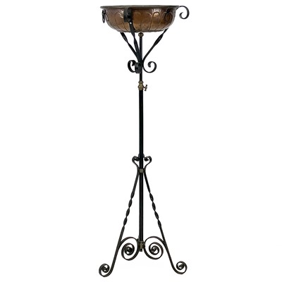 Lot 617 - A late Victorian wrought iron adjustable lamp stand.