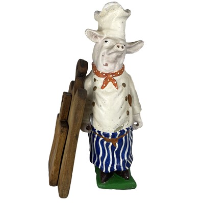 Lot 74 - A painted plaster figure of a pig.