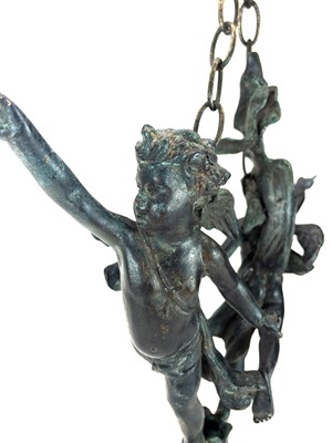 Lot 69 - A 19th century bronze hanging figure group of putti.