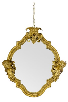 Lot 737 - A substantial gilt bronze wall mirror.