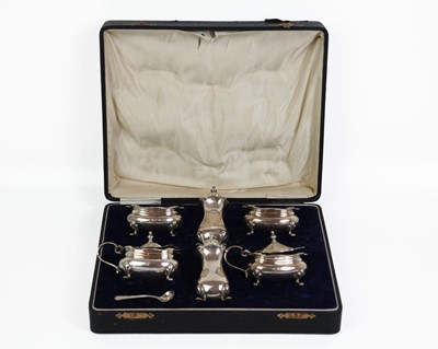 Lot 87 - A George V silver six-piece cruet set by Adie Brothers Ltd.