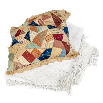 Lot 338 - A Victorian crazed patchwork cushion with fine lace frill.