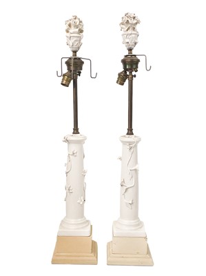 Lot 167 - A pair of Continental porcelain and brass column table lamps.