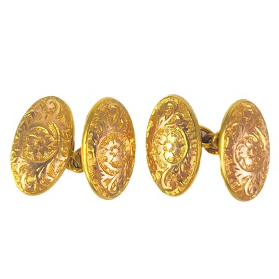 Lot 305 - A 9ct pair of oval foliate engraved cufflinks.